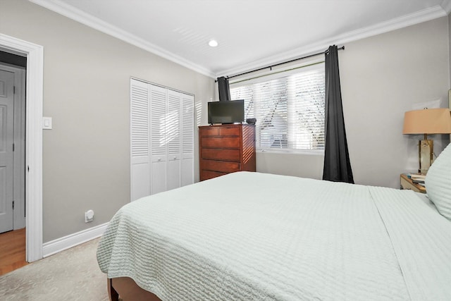 bedroom featuring a closet and crown molding