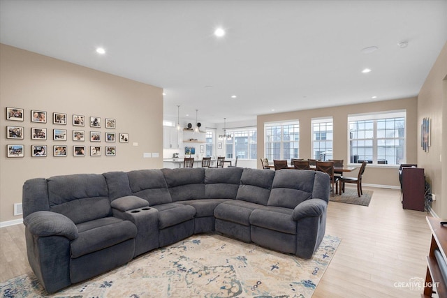 living room with light hardwood / wood-style flooring