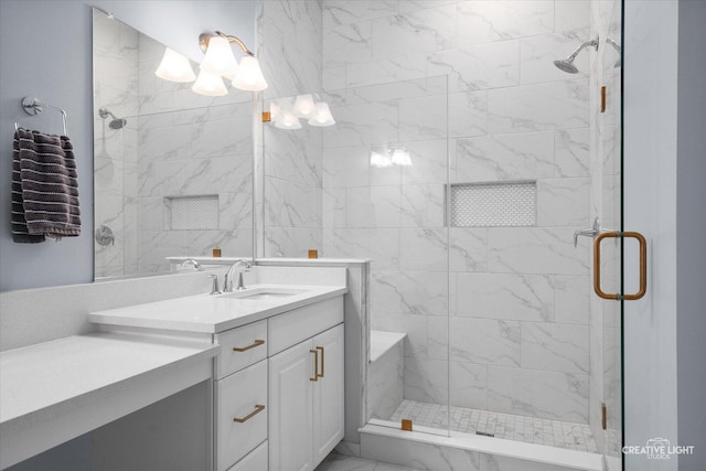 bathroom featuring walk in shower and vanity