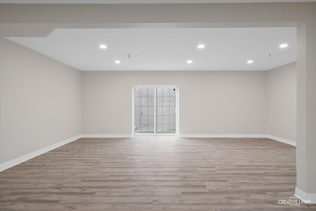 empty room with light hardwood / wood-style floors