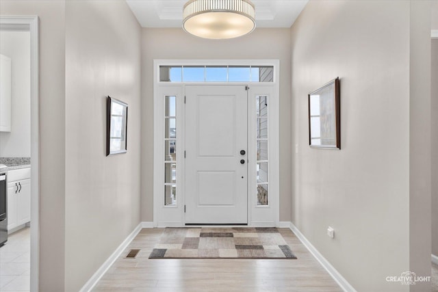 foyer entrance with light hardwood / wood-style flooring