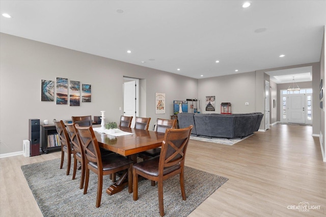 dining area with light hardwood / wood-style floors