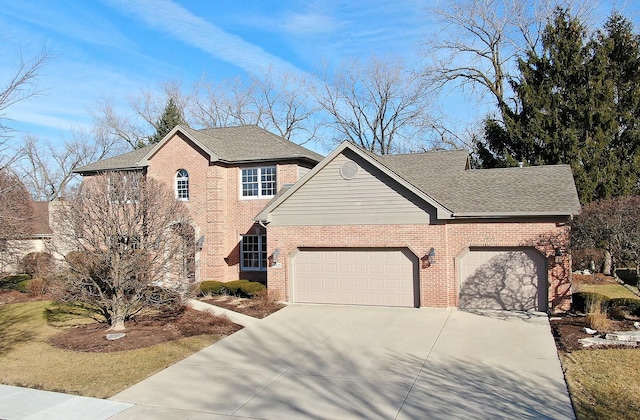 traditional-style house with driveway, brick siding, roof with shingles, and an attached garage