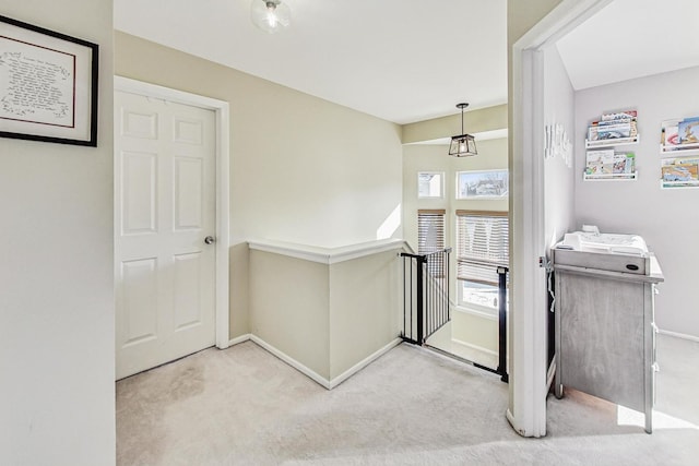 entryway with light colored carpet