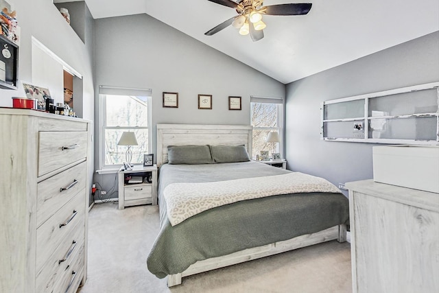 carpeted bedroom featuring high vaulted ceiling and ceiling fan