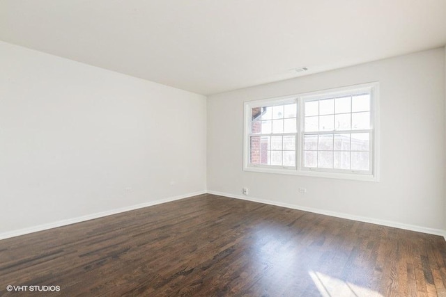 unfurnished room featuring dark hardwood / wood-style floors