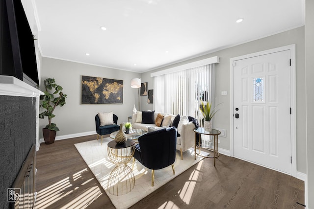 living room with ornamental molding and dark wood-type flooring