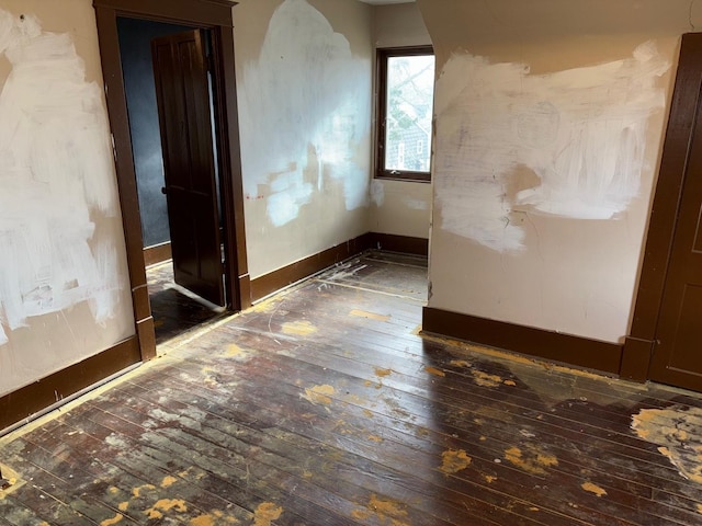 empty room featuring dark hardwood / wood-style floors