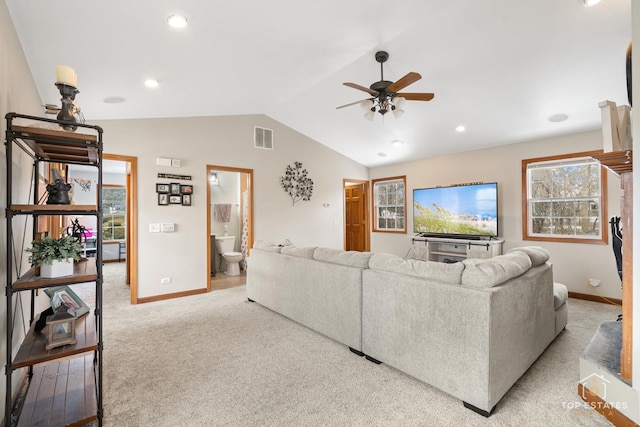 carpeted living room featuring lofted ceiling and ceiling fan