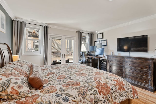 bedroom featuring wood-type flooring, french doors, crown molding, and access to exterior