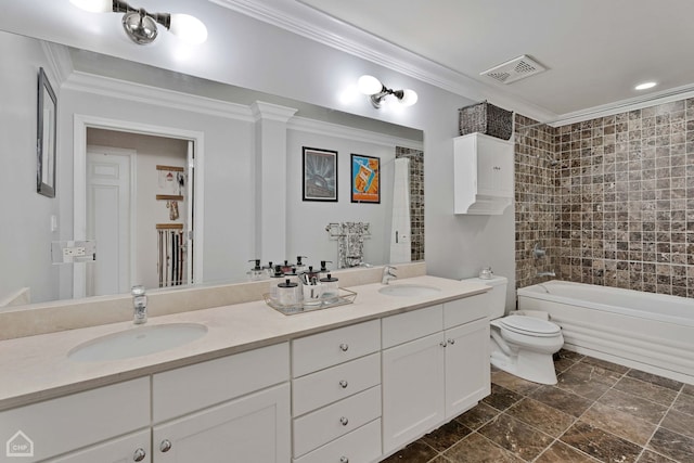 full bathroom featuring toilet, tiled shower / bath combo, vanity, and ornamental molding