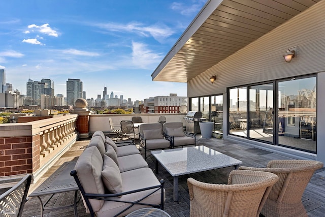 view of patio / terrace with a balcony and a grill