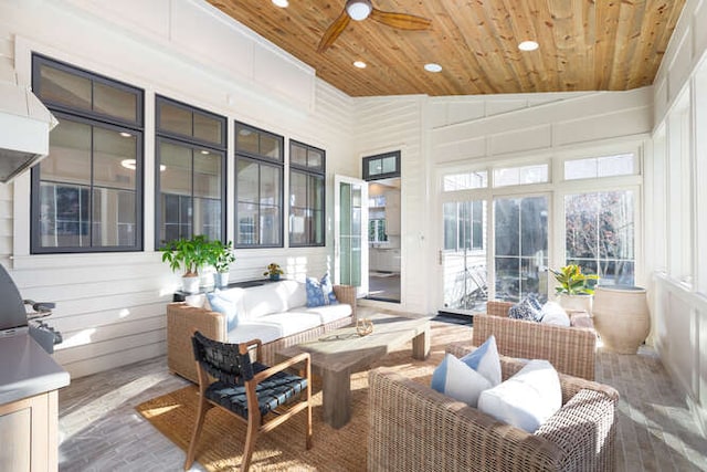 sunroom / solarium featuring ceiling fan, lofted ceiling, and wood ceiling