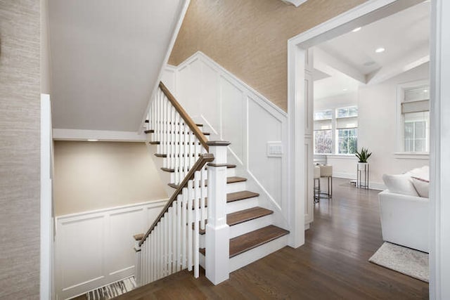 stairs featuring hardwood / wood-style floors