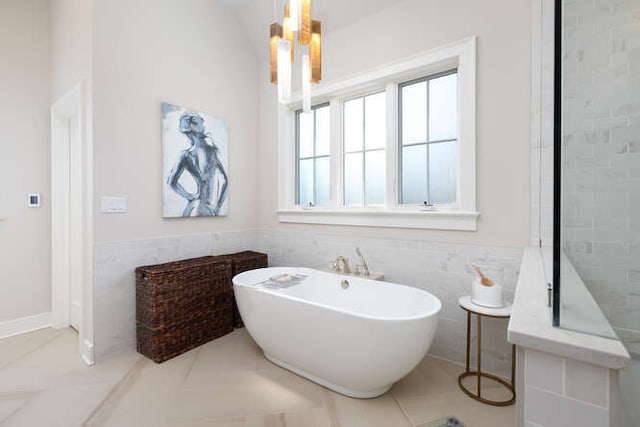 bathroom with tile walls and a washtub