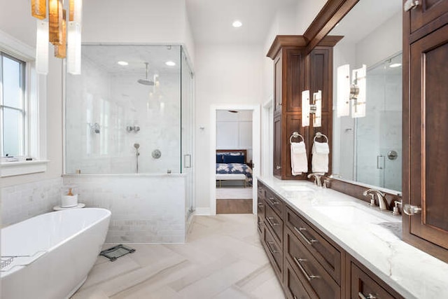 bathroom featuring vanity and plus walk in shower