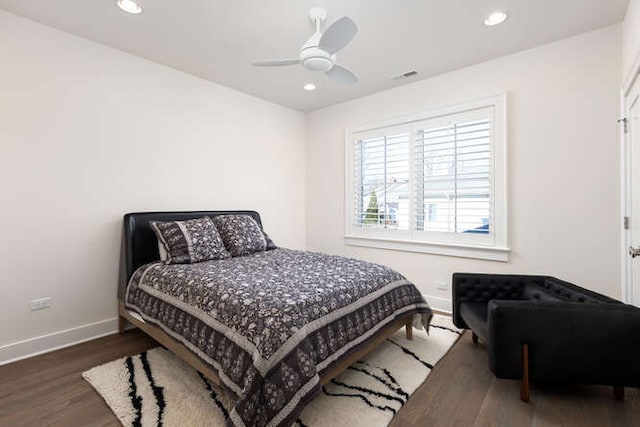 bedroom featuring dark hardwood / wood-style flooring and ceiling fan