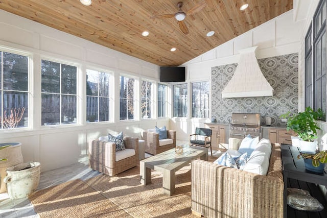 sunroom featuring ceiling fan, lofted ceiling, a wealth of natural light, and wood ceiling