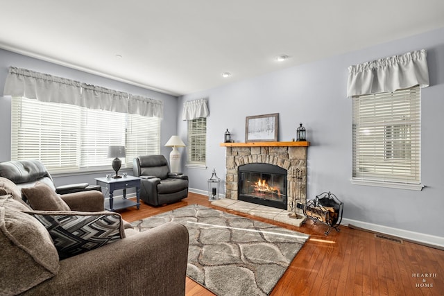 living room with a fireplace and hardwood / wood-style floors