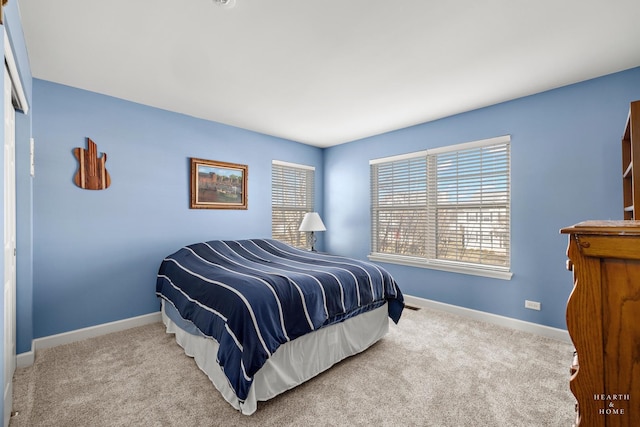 bedroom featuring light colored carpet