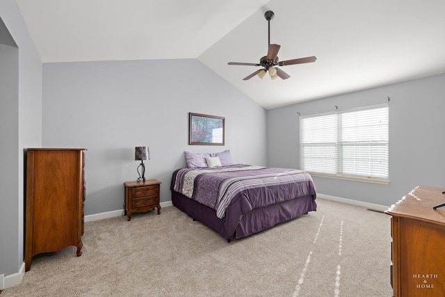 carpeted bedroom with ceiling fan and lofted ceiling