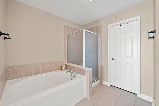 bathroom featuring tile patterned flooring and separate shower and tub