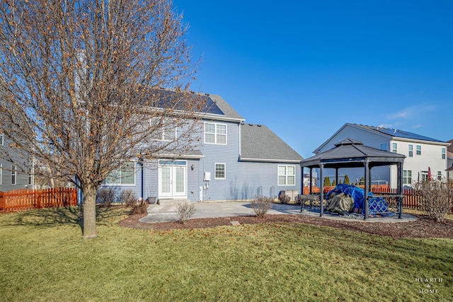 rear view of house featuring a gazebo, a patio area, and a yard