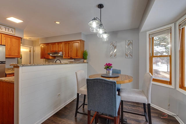 dining space featuring dark hardwood / wood-style flooring