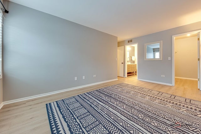 empty room with light hardwood / wood-style floors