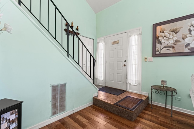 foyer with dark wood-type flooring and beverage cooler