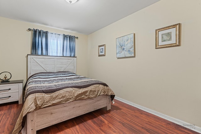 bedroom featuring dark hardwood / wood-style flooring