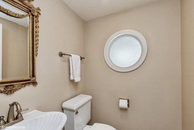 bathroom featuring sink and toilet