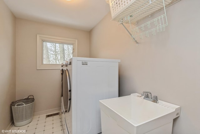 laundry room with washer / dryer and sink