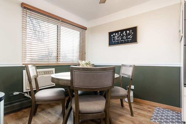 dining space with light wood-type flooring