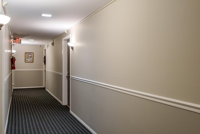 hall with dark carpet