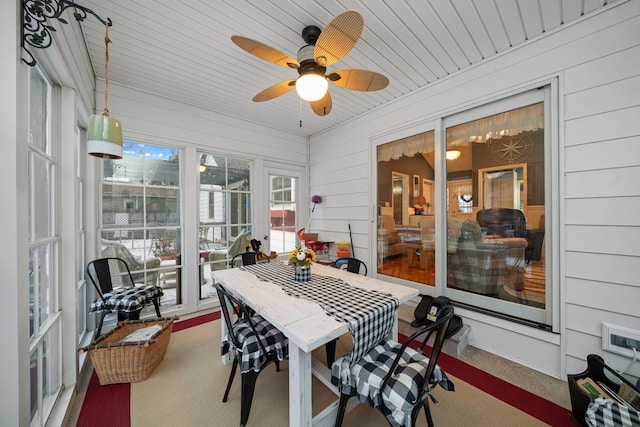 sunroom with ceiling fan and wood ceiling