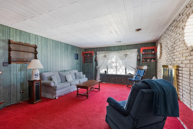 living room featuring wood ceiling, carpet, and a fireplace