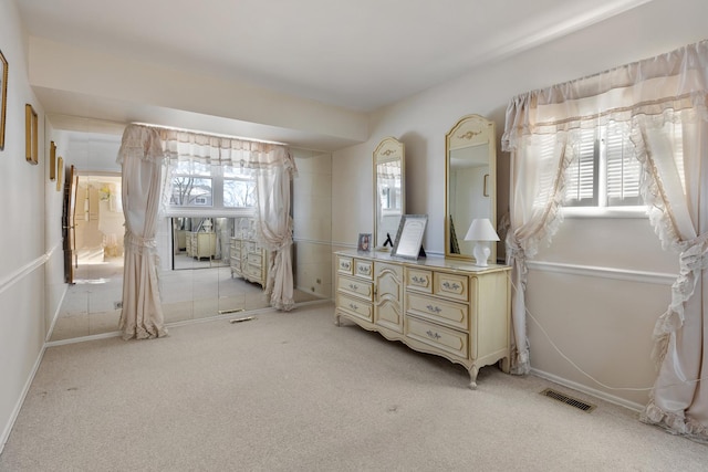 bedroom featuring light colored carpet