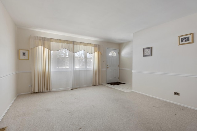 view of carpeted foyer