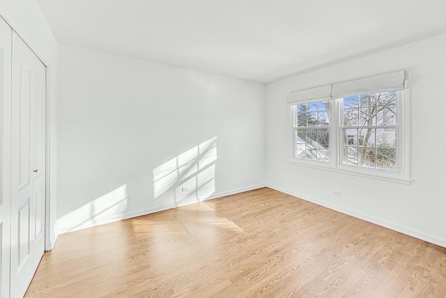 empty room with light wood-type flooring