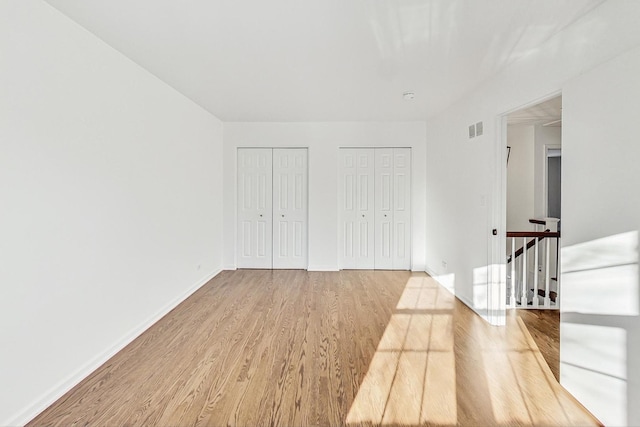 unfurnished room with light hardwood / wood-style floors