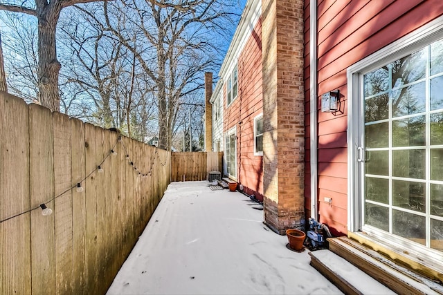 view of side of property featuring a patio and cooling unit