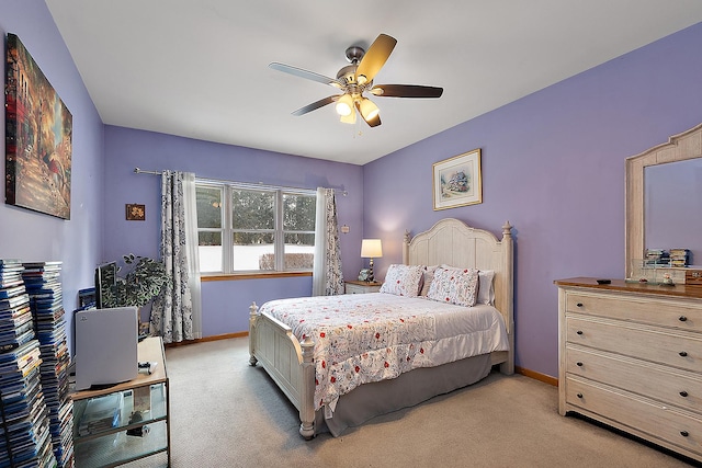 bedroom with light carpet and ceiling fan