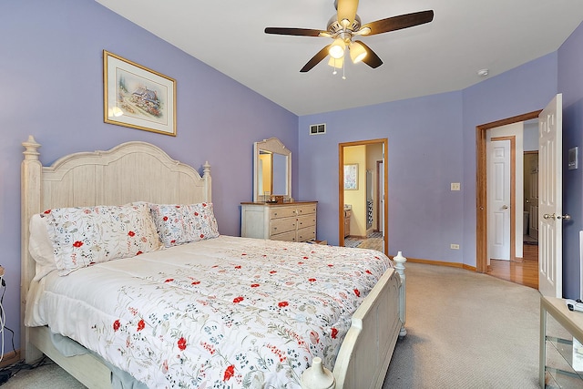 bedroom featuring light colored carpet and ceiling fan