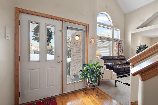 interior space with vaulted ceiling and hardwood / wood-style floors