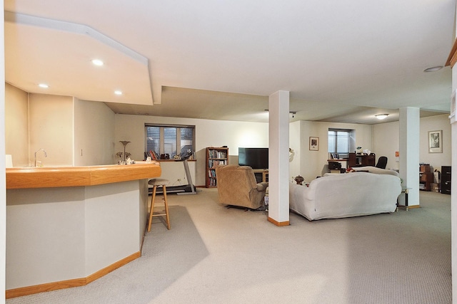 living room with carpet and indoor wet bar