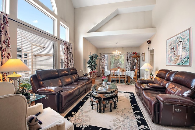 living room featuring a high ceiling and an inviting chandelier