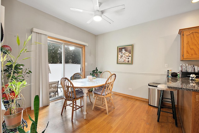 dining space featuring light hardwood / wood-style floors and ceiling fan