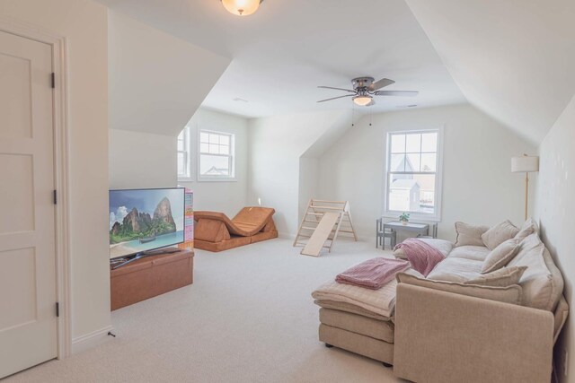 interior space with ceiling fan, light carpet, and a wealth of natural light