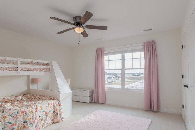 carpeted bedroom with ceiling fan